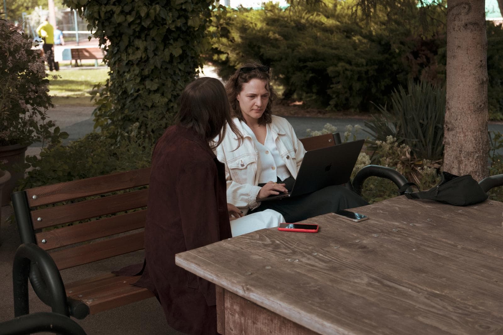 Working on a bench outdoors
